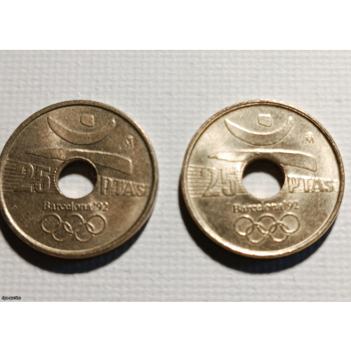 Two 25 Peseta coins issued in Spain during the reign of King Juan Carlos I to commemorate the XXV Summer Olympic Games 1992 in Barcelona.